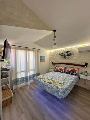 Oasi del Relax - Seaside Peaceful Panoramic Terrace in ITALY - new Sardinia apartment 50 mt beach&sea full comfort air conditioning-WiFi-Parking-Privacy Torre Dei Corsari
